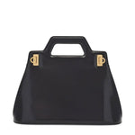 Black handbag with gold hardware on a white background