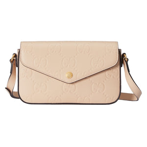 Beige handbag with brand logo on a light gray background