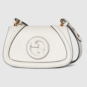 White handbag with a brand logo on a light gray background