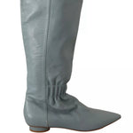Gray knee-high boot on a white background