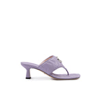 Purple sandal with a small heel on a white background