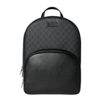 Black backpack with patterned top section on a light gray background