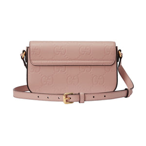 Pink handbag with gold accents on a light gray background