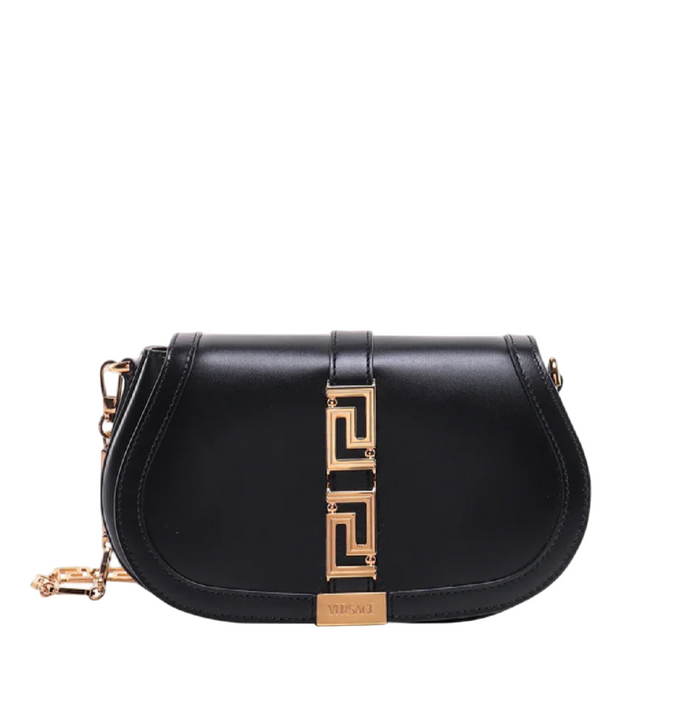 Black handbag with gold accents on a white background