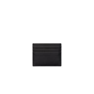Black leather cardholder on a light gray background