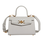 Gray handbag with gold accents on a white background