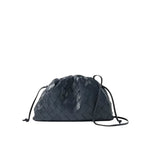Black woven drawstring bag on a light gray background