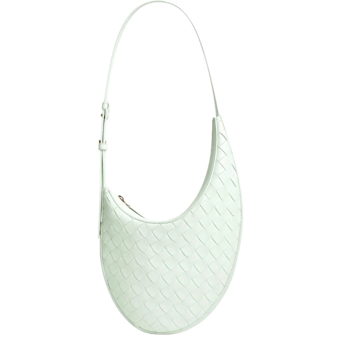 Light green handbag with a textured pattern on a white background