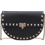 Black studded Valentino handbag with a chain strap on a white background