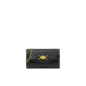 Black handbag with gold chain on a white background