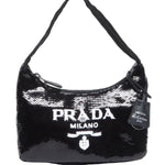 Black sequin handbag with Prada logo on a white background