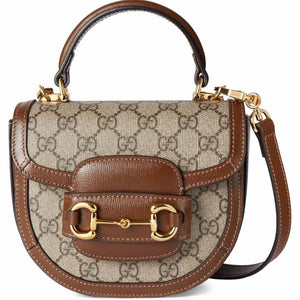 Designer handbag with brown and beige pattern on a white background