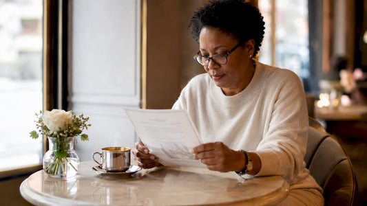 Woman verifying luxury item authenticity at home office