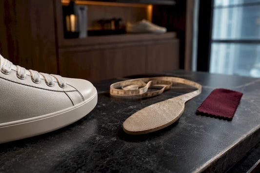 Anonymous sneaker fitting with measuring tools