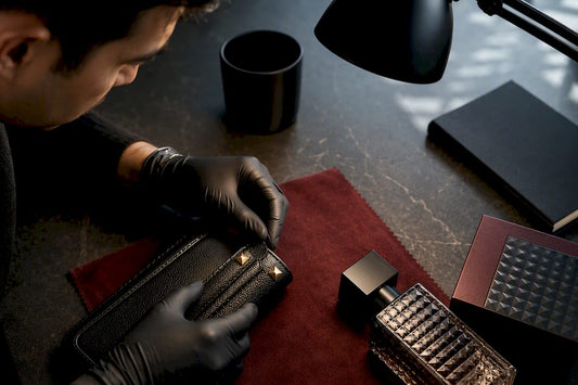 Hands comparing luxury item details