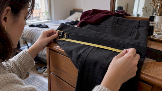 Tape measuring a Saint Laurent belt to its center hole
