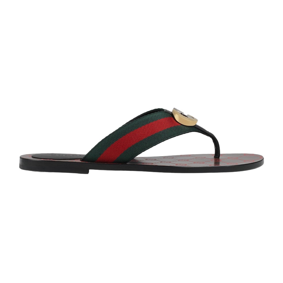 Flip-flop sandal with green and red striped strap on a light gray background