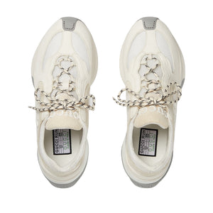 Pair of white sneakers with Gucci branding on a light gray background
