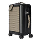 Black suitcase with patterned handle on a light gray background
