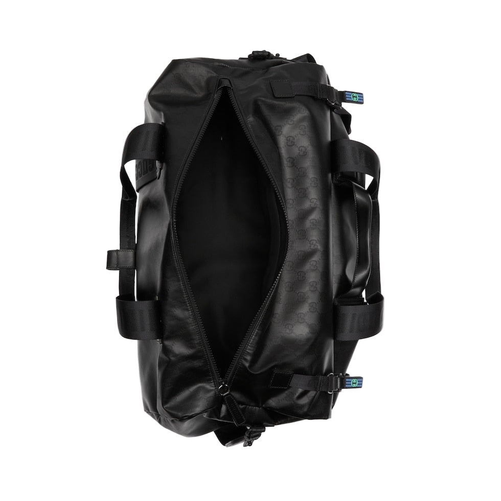 Black duffel bag on a light gray background