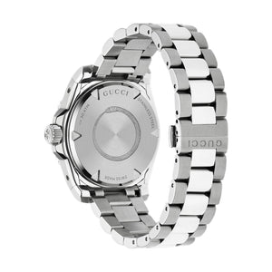Silver Gucci watch on a light gray background