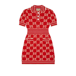 Red dress with Gucci logo pattern on a light gray background