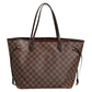 Brown checkered handbag on a white background