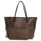 Brown checkered handbag on a white background