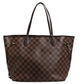 Brown checkered handbag on a white background