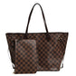 Brown checkered handbag on a white background