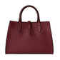 Burgundy leather handbag on a light gray background