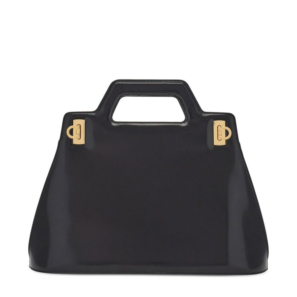Black handbag with gold hardware on a white background