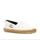White slip-on shoe with brown sole and 'Saint Laurent' branding on a white background