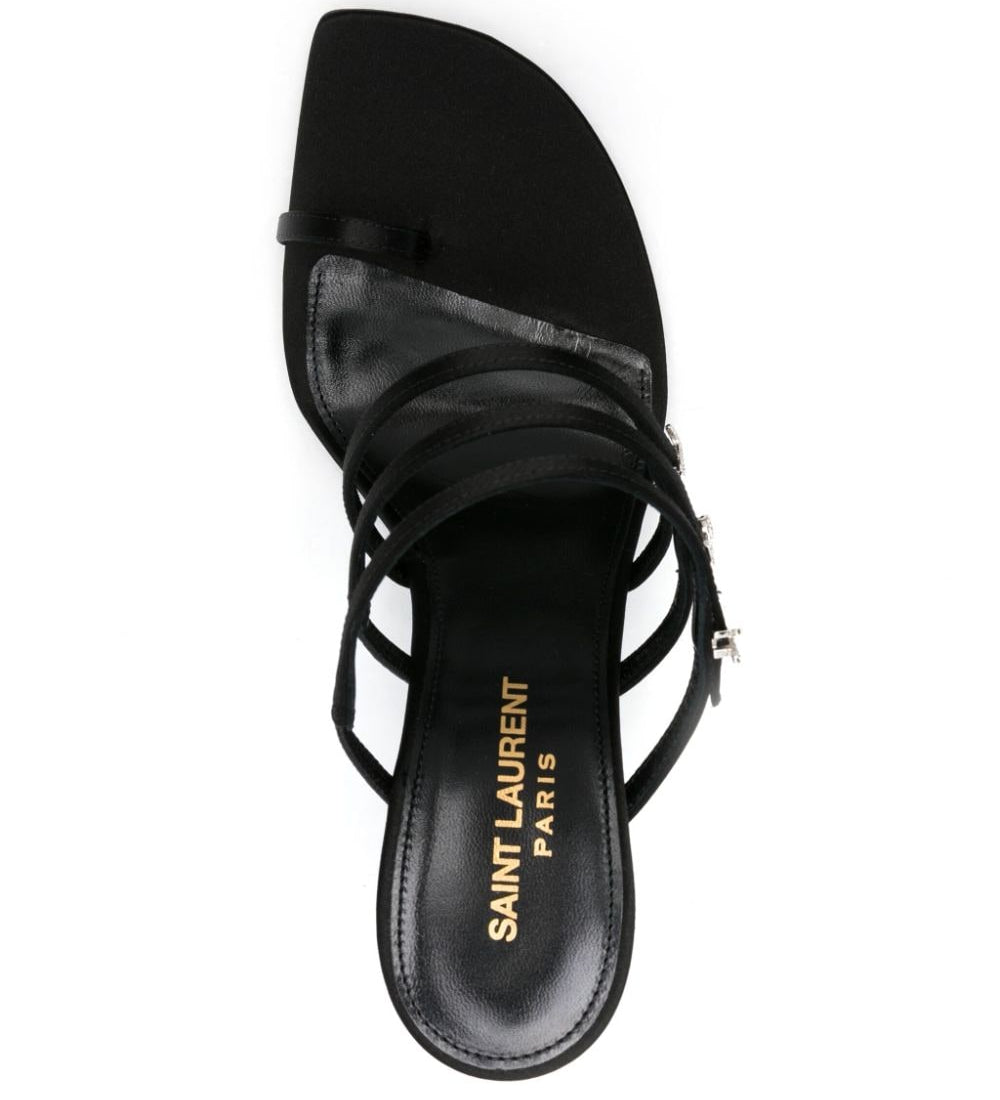 Black sandal with 'Saint Laurent Paris' logo on a white background
