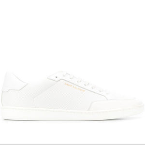 White sneaker with brand logo on a white background