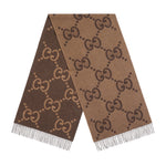 Brown scarf with Gucci logo pattern on a light gray background