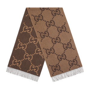 Brown scarf with Gucci logo pattern on a light gray background