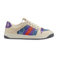 Beige Gucci sneaker with colorful accents on a white background