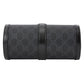 Black Gucci-patterned clutch bag on a light gray background