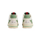 Pair of Gucci sneakers with green and red accents on a light gray background