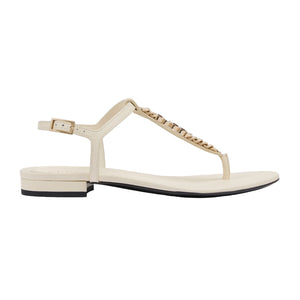 Beige sandal with a brand name on a white background