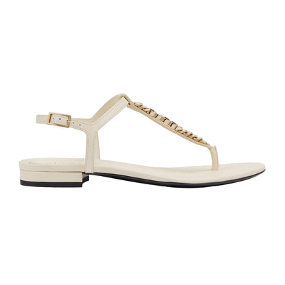 Beige sandal with a brand name on a white background