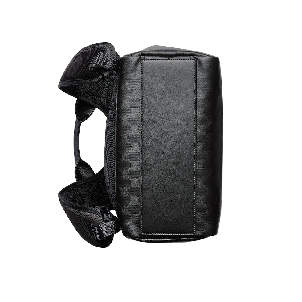 Black leather crossbody bag on a light gray background