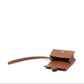 Brown leather wallet with a strap on a white background