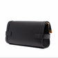 Black handbag with gold accents on a white background