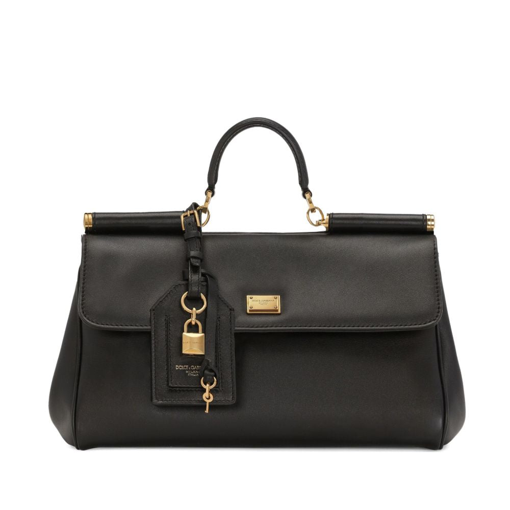Black handbag with gold accents on a white background