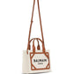 Balmain Paris tote bag with brown leather accents on a white background