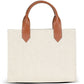 Beige tote bag with brown leather handles on a white background