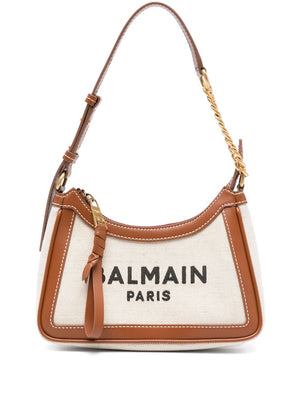 Balmain Paris handbag with brown leather accents on a white background