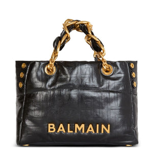 Black handbag with gold chain handle and 'Balmain' branding on a white background